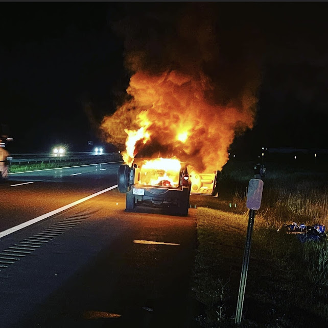 A vehicle fully involved on fire on the New York State Thruway northbound